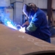 worker welding on large diameter pipe